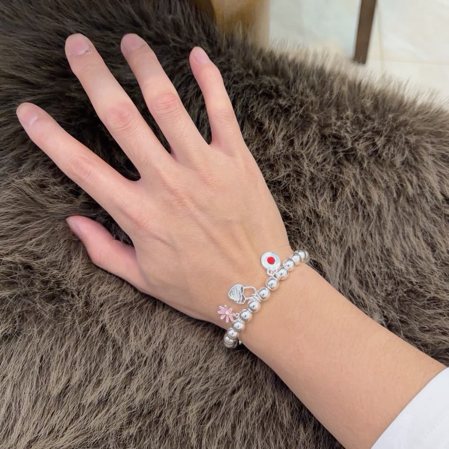 Tiffany & Co. Sterling Silver Bead Bracelet with Lock and Flower Charms